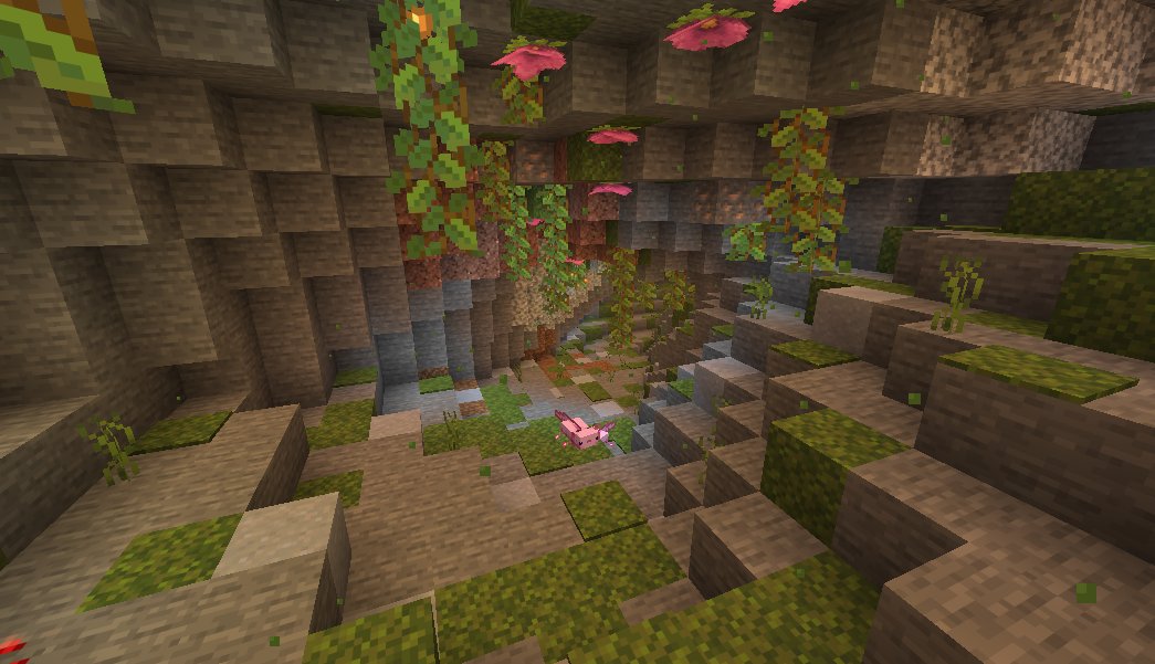 A lush cave pocket underground - moss, glow-berry vines, spore blossoms, and an axolotl pool.