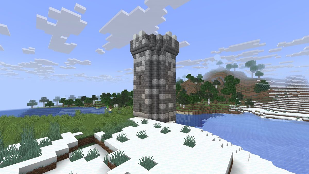 The round tower, with bands and windows under a stepped cap.